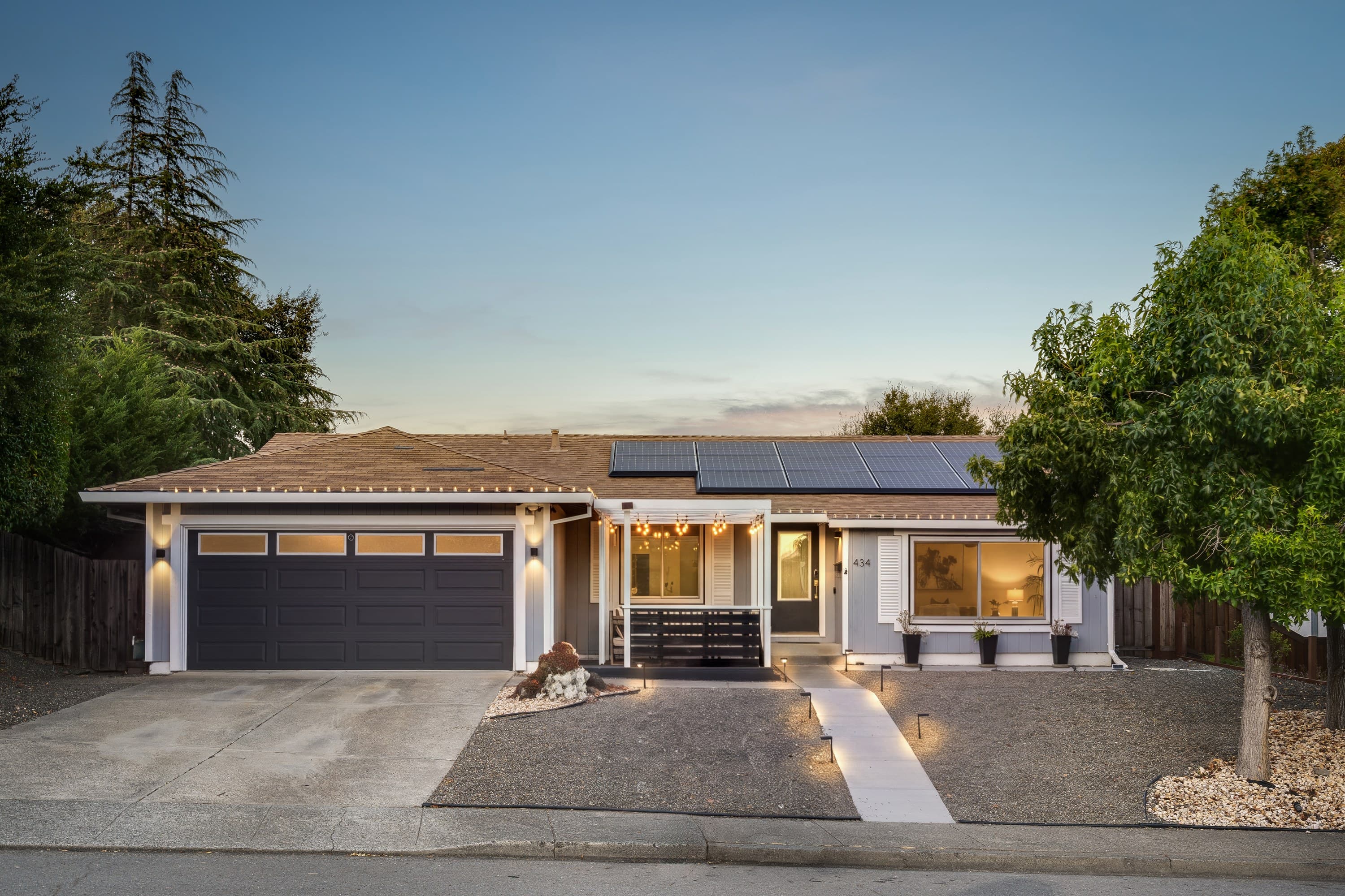 434 San Carlos Way at twilight, the front elevation lit from within.